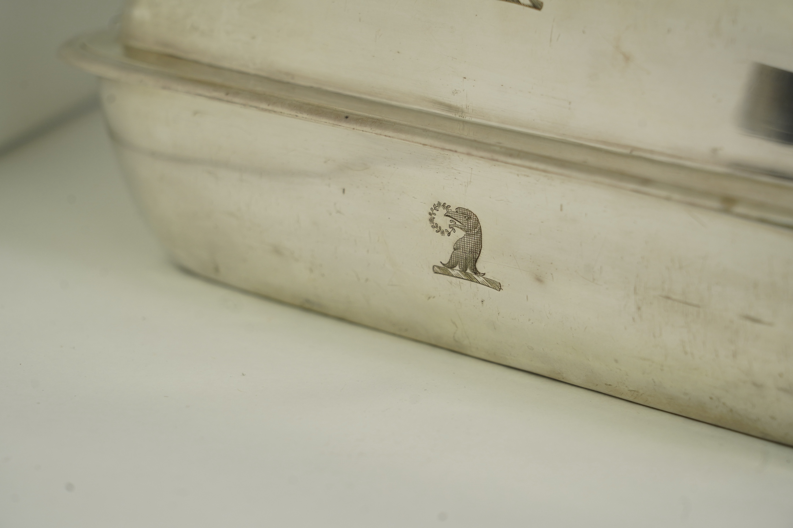 A pair of George IV silver entrée dishes and covers with handles, by John Edward Terry, engraved with the Tregonwell family crest